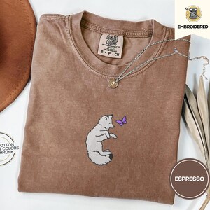 Embroidered Snow Fox Onyx Quicksilver Book Comfort Colors Tee, Fae and Alchemy Little Osha Kingfisher Shirt, Cozy Cute Tee