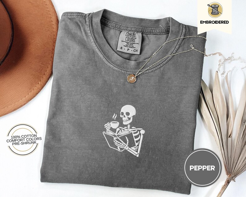 Embroidered Skeleton Reading a Book Shirt – Comfort Colors Book Lover Tee Cozy Aesthetic Embroidery Dark Academia Spooky Season Reader Shirt