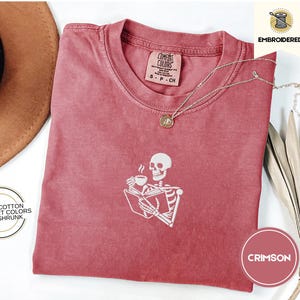 Embroidered Skeleton Reading a Book Shirt – Comfort Colors Book Lover Tee Cozy Aesthetic Embroidery Dark Academia Spooky Season Reader Shirt