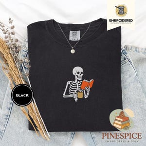 Skeleton reading book tee, embroidered skeleton coffee shirt, spooky book lover t-shirt, comfort colors 1717, fall vibes shirt, boo basket