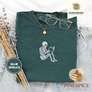 Skeleton reading book tee, embroidered skeleton coffee shirt, spooky book lover t-shirt, comfort colors 1717 fall vibes shirt, boo basket