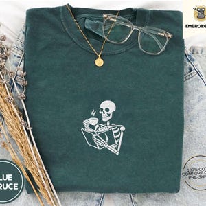 Embroidered Skeleton Reading a Book Shirt – Comfort Colors Book Lover Tee Cozy Aesthetic Embroidery Dark Academia Spooky Season Reader Shirt