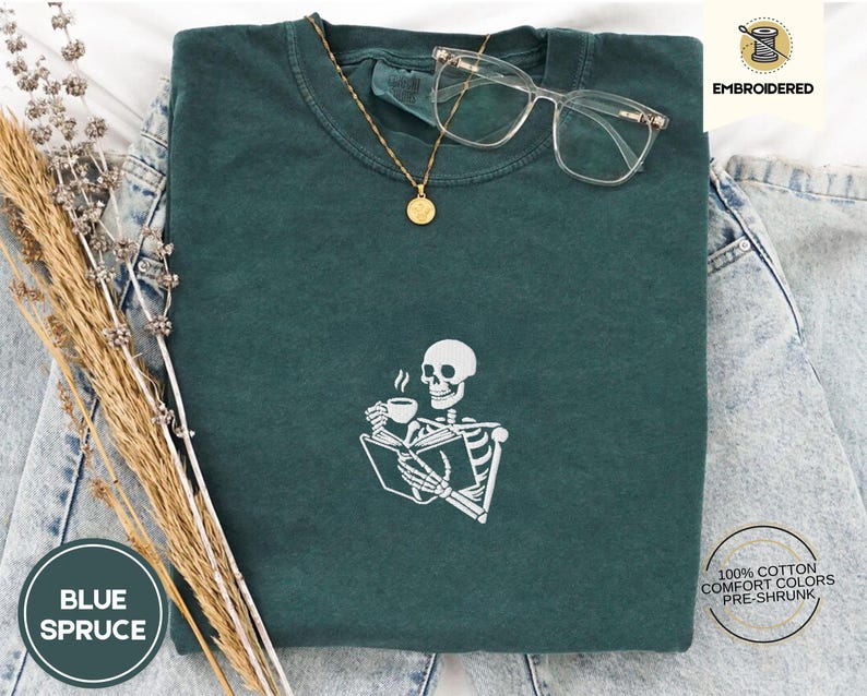 Embroidered Skeleton Reading a Book Shirt – Comfort Colors Book Lover Tee Cozy Aesthetic Embroidery Dark Academia Spooky Season Reader Shirt