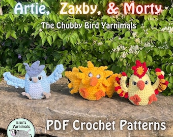 May include: Three crocheted bird figures named Artie, Zaxby, and Morty, the Chubby Bird Yarnimals. The light blue, yellow, and cream-colored birds feature textured wings and large eyes. Text reads: Artie, Zaxby, & Morty, The Chubby Bird Yarnimals, PDF Crochet Patterns.
