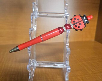 Bolígrafo mariquita roja