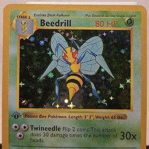 May include: A Beedrill Pokemon card from the first edition of the Pokemon Trading Card Game. The card features a yellow and black Beedrill with red eyes and blue wings. The card is set against a black background with stars and sparkles. The card's text reads "Poison Bee Pokemon. Length: 3' 3", Weight: 65 lbs."