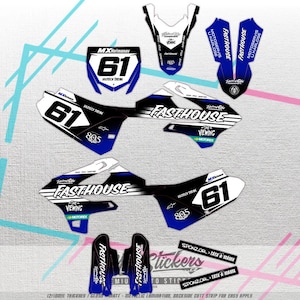 May include: A collection of motocross stickers featuring the "FASTHOUSE" logo, number "61", and the text "MXHermanov". The stickers are primarily black, white, and blue, with various shapes and sizes. The text "805" is also visible.