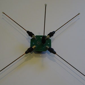 Ground plane antenna hub for portable ham radio and police scanners