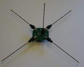 Ground plane antenna hub for portable ham radio and police scanners