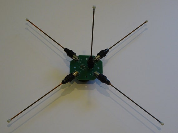 Ground plane antenna hub for portable ham radio and police scanners