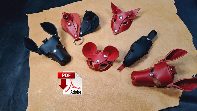May include: A collection of handcrafted leather animal-themed masks and accessories in red and black. The set includes various ear shapes, snout designs, and metal hardware fasteners, arranged on a tan leather hide background.