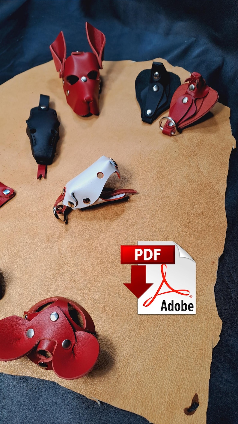 May include: A collection of leather accessories including a red dog-shaped mask, a black and a red key fob, a white and red animal-shaped keychain, and a red circular leather piece, all featuring silver-toned metal snaps and rings.