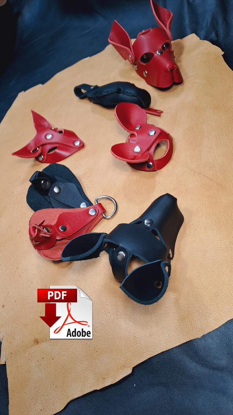 May include: A collection of red and black leather animal-shaped masks and accessories featuring silver-tone metal rivets and D-rings. The items are arranged on a tan leather hide. An Adobe PDF icon is visible in the lower left corner.