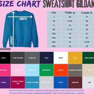 May include: A Gildan sweatshirt size chart featuring a blue crewneck sweatshirt illustration with width and length arrows. A table lists sizes from S to 5XL with measurements in inches. A colour palette grid displays various available fabric colours.