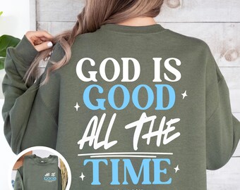 May include: Olive green sweatshirt with the text "GOD IS GOOD ALL THE TIME" in white and light blue. The number "365/365" is printed below the text. A smaller image of the sweatshirt is in the lower left corner.