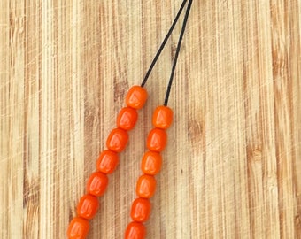 Cross Palm Komboloi Worry Beads, made with orange glass beads.