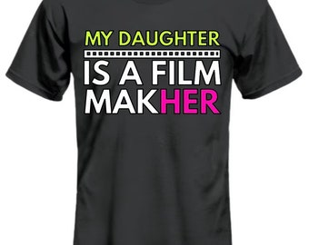 May include: A black t-shirt with the text "MY DAUGHTER IS A FILM MAKH[ER]" in white and green. The word "MAKH[ER]" is in pink.