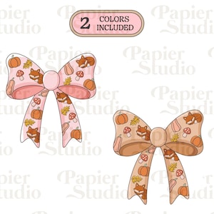 Puede incluir: Dos lazos decorativos con motivos otoñales. Uno es rosa claro, el otro es marrón claro. Ambos presentan calabazas, zorros, setas y hojas. El texto "2 COLORS INCLUDED" está en la parte superior.