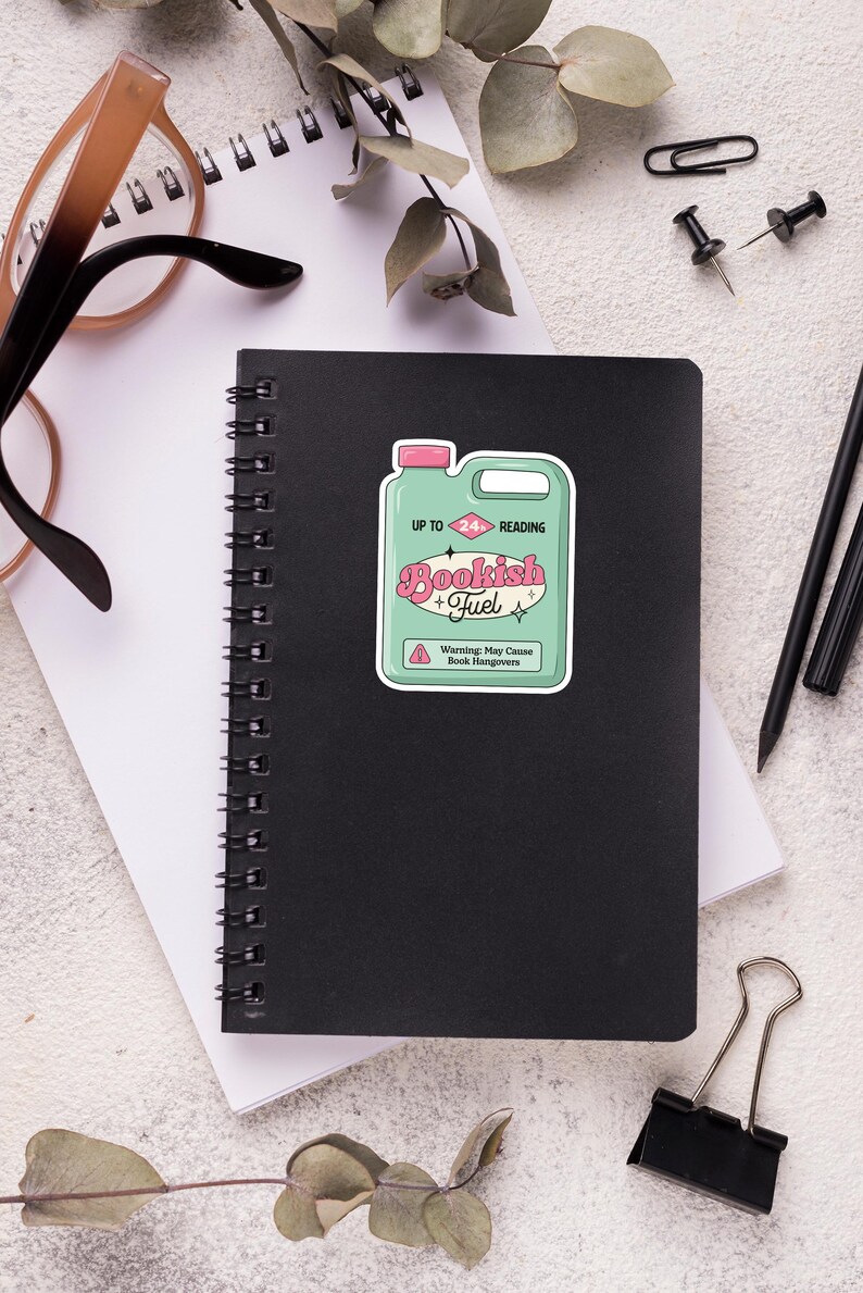 May include: A green and pink sticker with a cartoon illustration of a fuel container labeled "Bookish Fuel" with the text "Up to 24 Hours Reading" and a warning that it may cause "Book Hangovers".