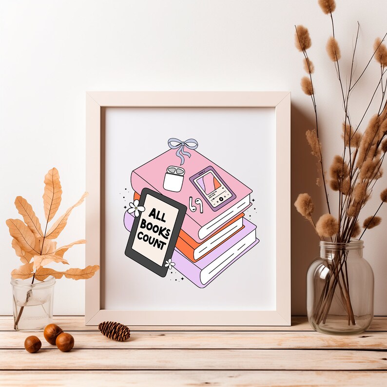 May include: A white framed print with a pink, orange, and purple stack of books. The top book has a white wireless earbud case and a pink phone with a screen that says "67". The print says "All Books Count" in black text.