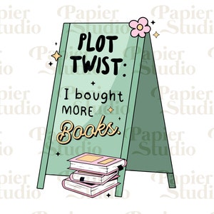 May include: A green A-frame sign with the text "PLOT TWIST: I bought more books." A stack of pink and white books sits in front of the sign.