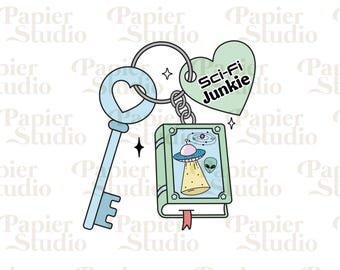 May include: A green heart-shaped charm with the text "Sci-Fi Junkie" attached to a key with a heart-shaped hole and a book charm with a spaceship and alien illustration. The charm is attached to a silver key ring.