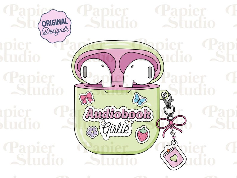 May include: A light green AirPods case with pink interior, holding white earbuds. The case is decorated with stickers, including a bow, butterfly, flower, and strawberry. Text on the case reads "Audiobook Girlie". A charm with a book and heart hangs from the case.