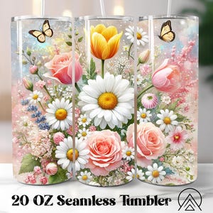 May include: A 20 oz seamless tumbler featuring a floral design with pink roses, white daisies, yellow tulips, and butterflies. The tumbler has a clear background with a watercolor effect, and the text "20 OZ Seamless Tumbler" is printed at the bottom.