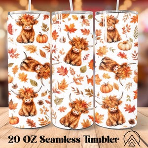 May include: A cylindrical 20 oz tumbler featuring a repeating pattern of brown Highland cattle, orange pumpkins, and multicolored autumn leaves on a white background. The design includes a clear lid and a white straw, showcasing a seasonal theme.