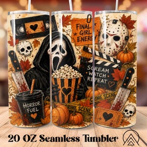 May include: A 20 oz cylindrical tumbler featuring a horror-themed graphic print with a masked figure, a hockey mask, skulls, pumpkins, autumn leaves, knives, a popcorn bucket, a film clapperboard, and a VHS tape with text reading Final Girl Energy.