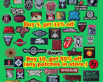 May include: A collection of various rectangular, circular, and shaped embroidered music band patches featuring logos and graphic designs in black, white, red, and blue on a green background, with yellow text promoting store discounts.