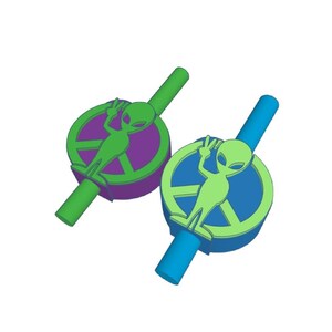 May include: Two green alien figures with peace signs on their heads are attached to green and blue drinking straws. The straws are decorated with peace signs and the aliens are green.