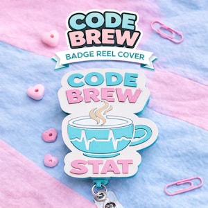 May include: A badge reel cover with the words "CODE BREW" in blue and pink, and a teal coffee cup design with a heartbeat line. The word "STAT" is below the cup. The background is pink and blue.