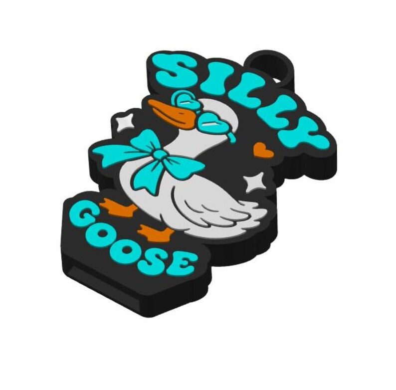 May include: A black charm with the words "SILLY GOOSE" in turquoise letters. The charm features a cartoon goose with a turquoise bow, orange feet, and a turquoise beak. The goose is white with gray wings.