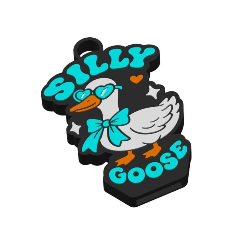 May include: A black and white charm featuring a cartoon goose wearing teal glasses and a bow tie. The words "SILLY GOOSE" are written in teal letters. The goose has orange feet and a beak.