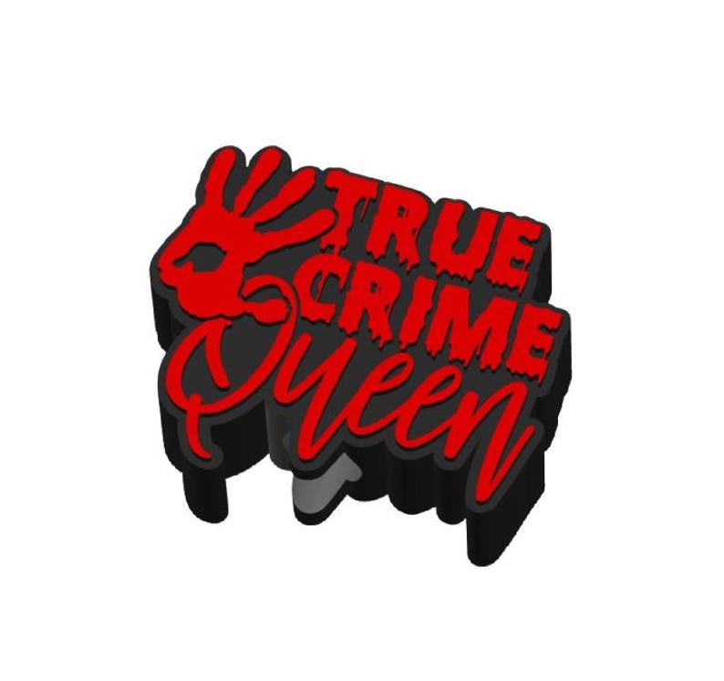 May include: A black and red shoe charm with the text "TRUE CRIME Queen". The charm features a red handprint and a dripping effect on the text. The design is 3D and has a shadow effect.