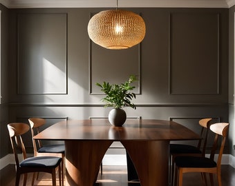 May include: A modern dining room with a wooden table and chairs. The table has a unique curved design and the chairs are upholstered in black fabric. A woven pendant light hangs above the table.