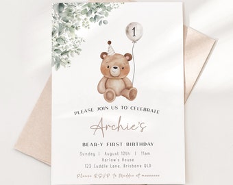 Peut inclure: Une invitation imprimable pour un premier anniversaire sur le thème de l'ours en peluche. L'invitation présente une illustration de dessin animé d'un ours en peluche brun portant un chapeau de fête et tenant un ballon avec le numéro 1 dessus. Le texte sur l'invitation se lit comme suit : "Veuillez vous joindre à nous pour célébrer le premier anniversaire d'Archie, un ours en peluche."