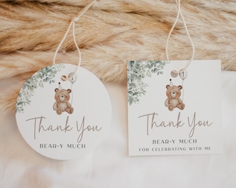 May include: Two thank you tags featuring a brown bear wearing a party hat and holding a balloon. The text on the tags reads "Thank You Bear-Y Much" and "Thank You Bear-Y Much For Celebrating With Me".