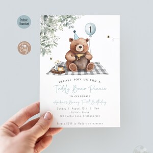 May include: A birthday invitation with a teddy bear illustration, a blue balloon, and the text "Teddy Bear Picnic". The invitation includes event details and RSVP information. The design has a watercolor style.