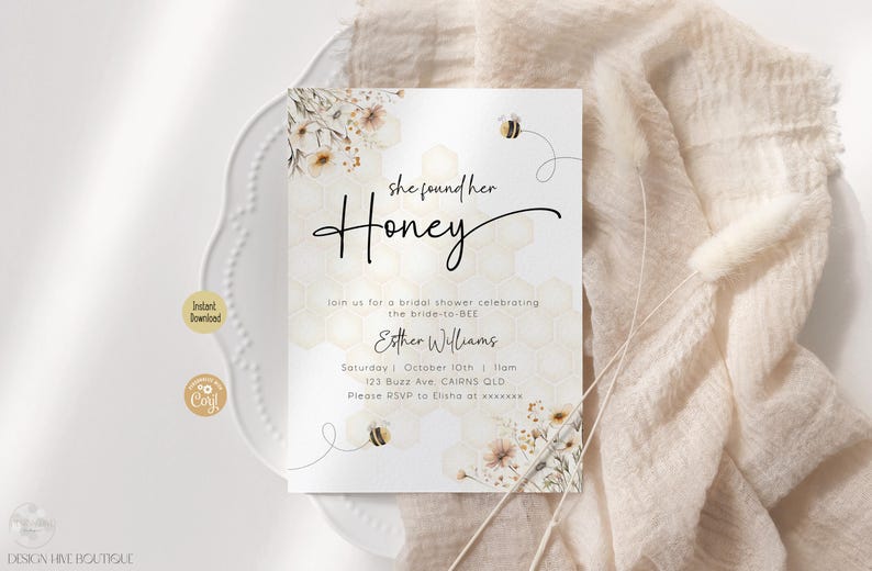 May include: A white bridal shower invitation with a watercolor background featuring a bee and flowers. The text reads "She found her Honey" and includes details for the event, such as the date, time, and location.