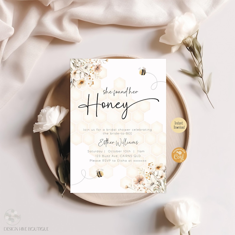 May include: A white bridal shower invitation with a honeycomb pattern and floral illustrations. The text reads "she found her Honey" and includes the bride-to-be's name, date, time, and location. The invitation also includes the text "Instant Download" and "Coril".