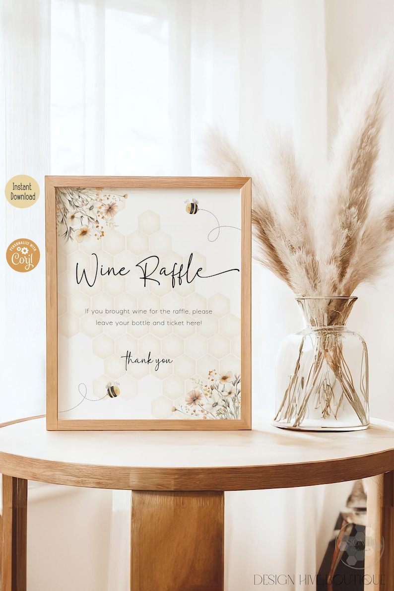May include: A printable sign with a honeycomb pattern and floral accents. The sign says "Wine Raffle" and includes the text "If you brought wine for the raffle, please leave your bottle and ticket here! Thank you."