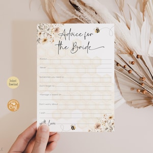 May include: A printable advice for the bride card with a honeycomb pattern and floral design. The card has the text "Advice for the Bride" and includes prompts for guests to write advice for the bride.