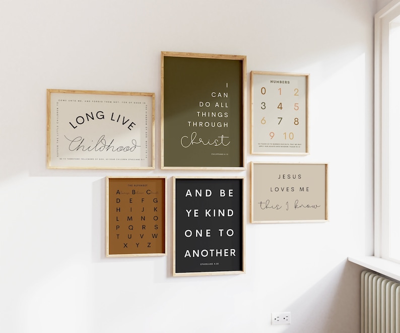 May include: A set of six framed prints with inspirational quotes and designs. The prints are in various colors, including brown, black, green, and beige. The quotes include "Long Live Childhood", "I Can Do All Things Through Christ", "Numbers 0-10", "Jesus Loves Me This I Know", "The Alphabet", and "And Be Ye Kind One To Another".