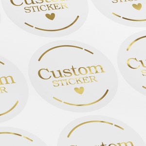 May include: White round stickers with gold lettering that says "Custom Sticker" and a small gold heart.