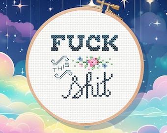 May include: A cross-stitch embroidery hoop with the words "FUCK THIS SHIT" in dark blue thread. The design includes floral accents in pink, blue, and green. The hoop is set against a dreamy, celestial background with stars and clouds.