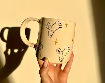 Minimalist pottery latte mug, hand drawn ceramic mug, jumping bunny cup, star motif pottery