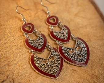 Handmade Moroccan Berber silver earrings, heart-shaped, in blue, red, and black. Elegant oriental bohemian chic jewelry