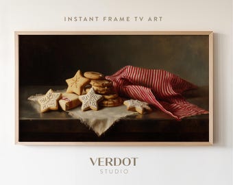 May include: A framed digital art print featuring a still life with star-shaped cookies, a stack of round cookies, and a red and white striped cloth. The text "INSTANT FRAME TV ART" is at the top, and "VERDOT STUDIO" is at the bottom.